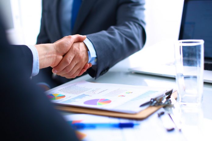 Business people shaking hands, finishing up a meeting